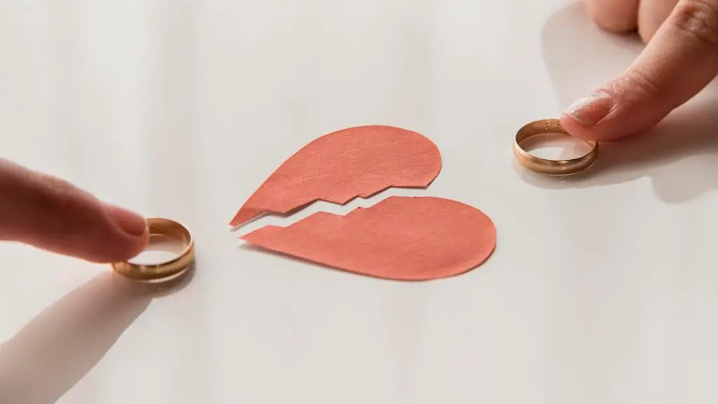 high-angle-hands-touching-wedding-rings