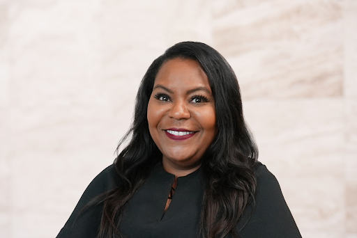 Meahgan Dickerson, family law attorney at the Law Office of Bryan Fagan, PLLC, smiling in professional attire against a neutral background, emphasizing her approachable demeanor and expertise in family law.